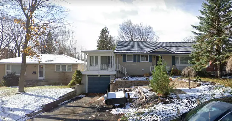 Roofing crew installing shingles